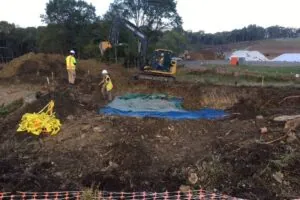 Mechanical Stripping Of Grave Sites