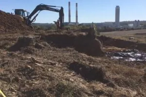 Mechanical Stripping Of Grave Sites